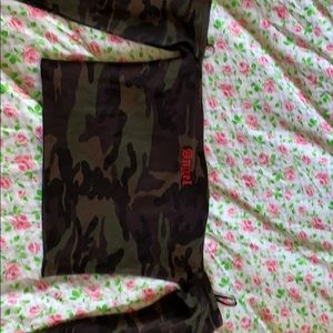 A camo off the shoulder long sleeve